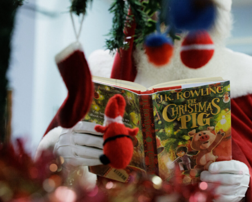 Father christmas reading a book