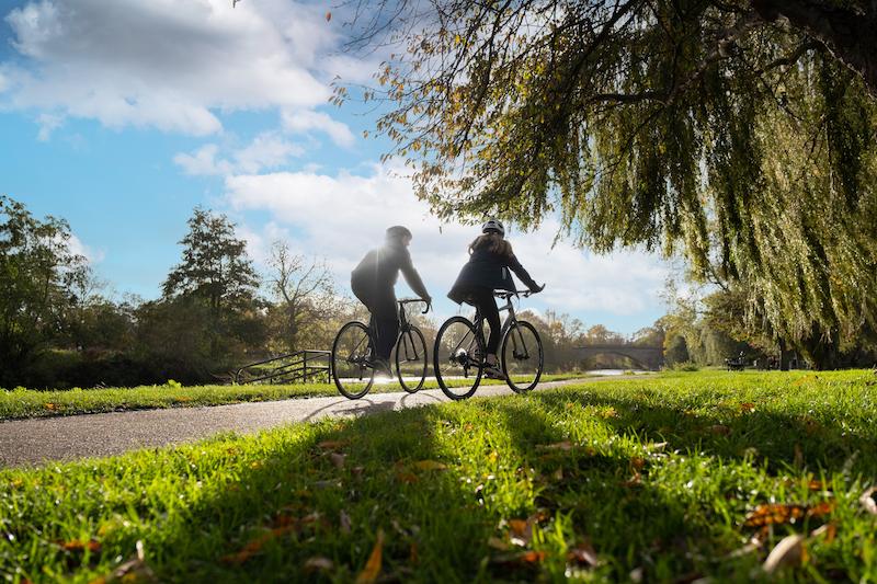 People riding bikes through the countryside